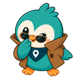 Roamio in sunglasses and a trench coat, peeking out from behind the footer